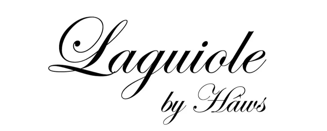 Logo for Laguiole by Haws i elegant sort skråskrift på hvid baggrund